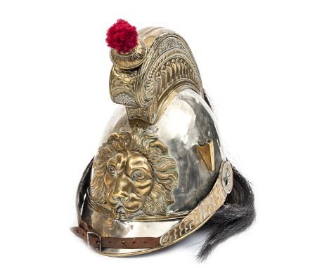 A late 19th century Belgian cuirasier’s helmet, WM skull and peaks, brass peak binding, tall comb, the sides embossed with vo