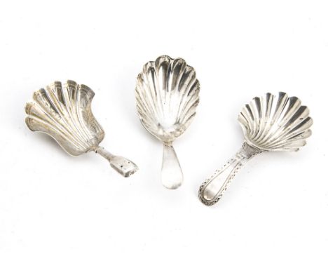 A group of three George III and later silver tea caddy spoons, each with shell shaped bowls, one by Peter & Ann Bateman, anot