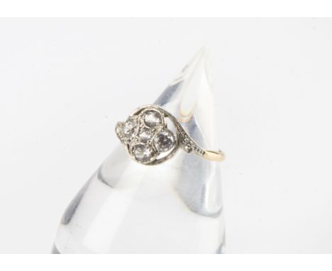 An Art Deco paste dress ring, the platinum and 18ct gold mount set with clear stones, 2.6g 