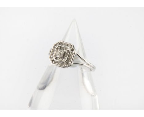 A modern Art Deco style 9ct white gold and diamond cluster dress ring, 1.7g and size M / N 