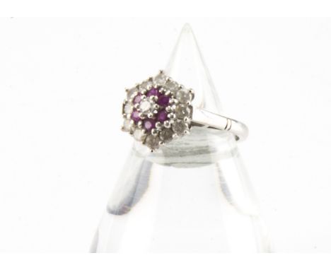 A 1970s 18ct white gold diamond and ruby cluster ring, 4.7g and size Kgenerally good condition, no obvious signs of significa