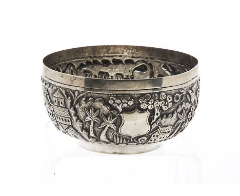 A vintage Indian silver sugar basin, having embossed town scene and interestingly with a steam locomotive and two train carri