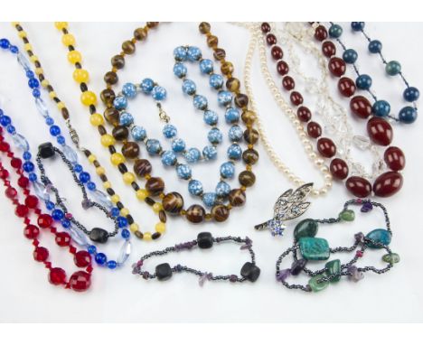 An Art Deco cherry amber style bead necklace, together with seven bead necklaces, a pearl necklace, four bead bracelets and a