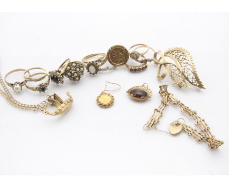 A collection of 9ct gold and yellow metal jewellery, including twelve rings, a pierced leaf shaped brooch, a gate link bracel