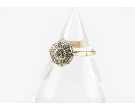 An Art Deco period 18ct gold and diamond cluster ring, with platinum to round tablet, set with brilliant cuts, 3.5g and size 