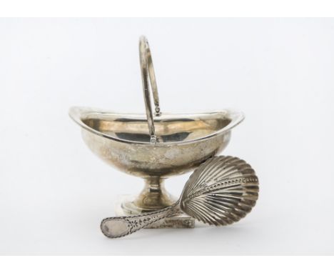 A Georgian silver tea caddy spoon by WB, having repaired bright cut handle and fluted bowl, together with a late Victorian si