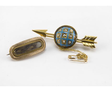 A Victorian gold seed pearl and turquoise enamel arrow shaped brooch, together with a Georgian gold mourning brooch with hair