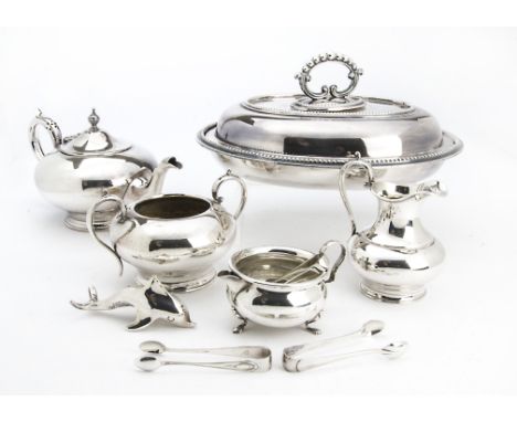 A cased George V silver Christening egg cup and spoon, together with a Harrods cased silver feeding set, a silver plated four