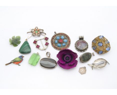 A large collection of vintage and modern jewellery, presented in plastic compartmented boxes, with brooches, pendants and mor