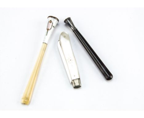 An Art Deco period enamelled cigarette holder, together with another tortoiseshell style example and a silver and mother of p