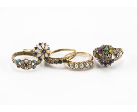 A group of five gold and yellow metal rings, including a 9ct gold DEAREST ring, a damaged 9ct gold opal and amethyst ring, a 