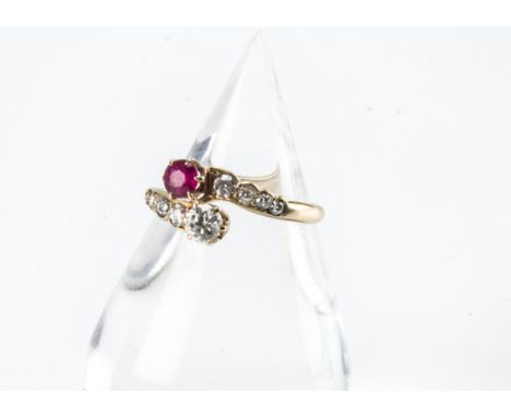 A vintage 14ct gold diamond and ruby crossover ring, 2g and size P 