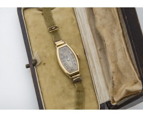 An Art Deco period 18ct gold cased lady's wristwatch, oblong and housing an S & Co movement, appears to run, on a fine mesh b