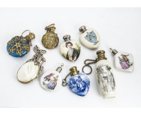 A collection of nine early 20th Century and later scent bottles, one crested porcelain example for Reading with silver cap, t