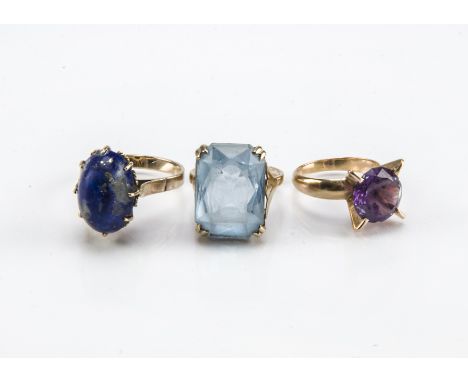 Three vintage yellow metal cocktail dress rings, including one with a lapis lazuli stone marked 750, 4.9g, one with a SCA mar