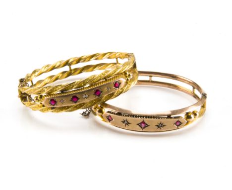 Two Victorian and later 9ct gold ruby and diamond bangles, one with double twist rims and tablet with seven stones, the other