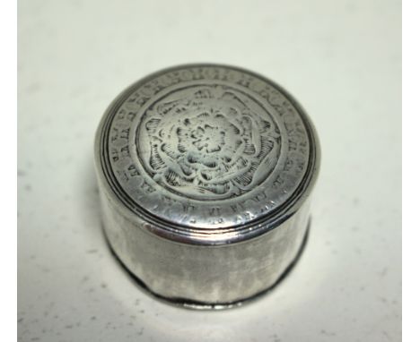 A late 17th century silver patch box, maker's mark of a five pointed star to the base, the pull-off cover engraved with a Tud