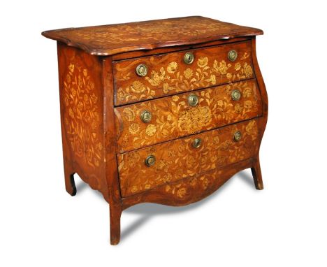 An early 19th century Dutch mahogany and marquetry inlaid bombe commode, of serpentine outline, decorated with floral spray, 