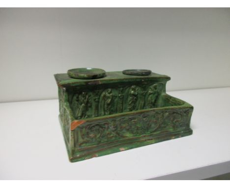 A green glazed pottery inkstand, possibly mid 19th century French, the removable sander and inkwell in receivers on an altar 