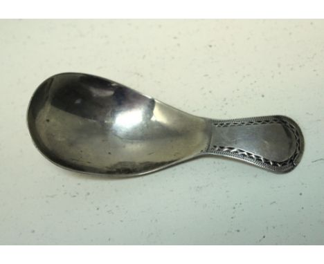 A George III Irish silver bright cut patterned caddy spoon, Maker J.S, Dublin circa 1800, 8cm 