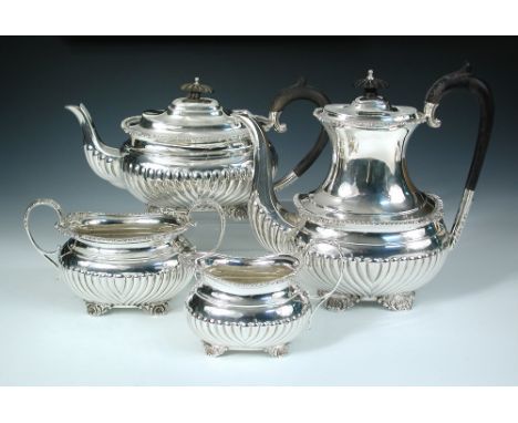 An Edwardian silver four piece tea and coffee service, by the Barker Brothers, Birmingham 1901/1902, comprising:- a teapot of