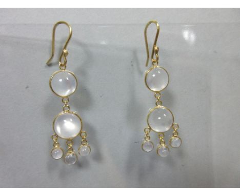 A pair of modern chandelier style moonstone earpendants, each bead-fronted wire hook suspending an articulated line of two ro