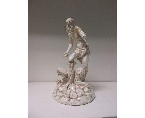 A white pottery figure of St Jerome and the lion, possibly 18th century Alcora, he stands above a reclining lion with his rig