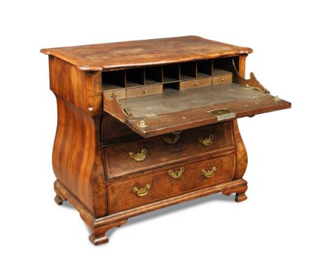 An early 19th century Dutch walnut bombe commode, with secretaire drawer and three further long drawers, brass plate handles 