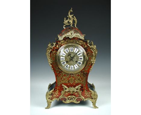 A 19th century Boullework table clock, the waisted case with tortoiseshell and brass front, ebonised sides, gilt metal mounts