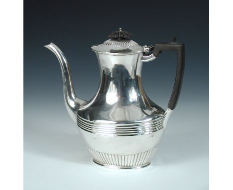 An Edwardian silver coffee pot, by John Bodman Carrington, London 1901, of oval baluster shape, the lower body fluted below a