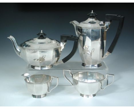 A silver four piece teaset, by Walker and Hall, Sheffield 1937, comprising:- a teapot of tapering decagonal form with stepped