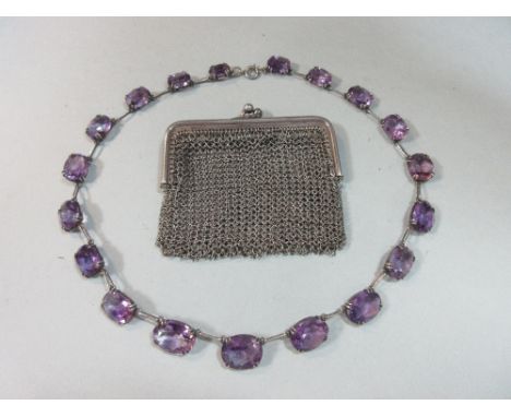 An amethyst rivière necklace together with French silver chain mail coin purse, the necklace composed of nineteen graduated o