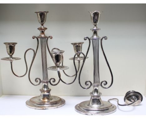 A pair of Old Sheffield plate three light candelabra, each with lyre stem supporting two branches (branch detached from one),