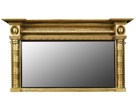 A Regency gilt framed overmantle mirror, with ring turned column moulded frame 69 x 122cm (27 x 48in) Regilded framed