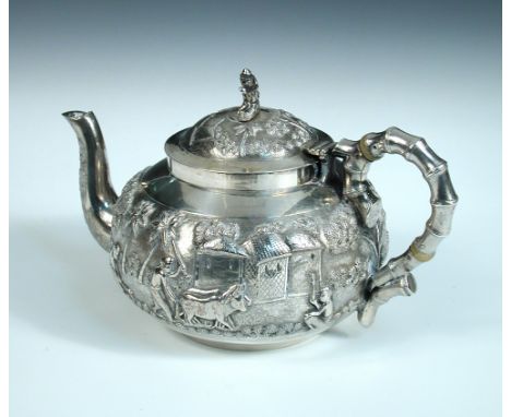 An Indian silver teapot, by Dass & Dutt, Bhowanipore and Calcutta, round, embossed with figures and cattle in an agricultural