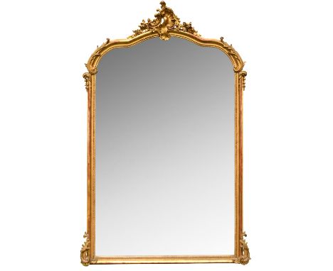 A 19th century gilt gesso framed pier mirror, with leaf moulded cornice 180 x 120cm (70 x 47in) The condition is considered t