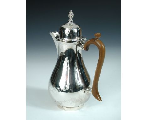 A silver hot water jug by S Blanckensee & Sons Ltd, Birmingham 1923, of plain baluster shape with ring foot and domed cover w