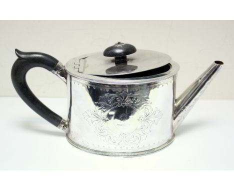 A George III silver teapot, by Hester Bateman, London 1785, oval and brightcut engraved between beaded edges, flush hinged co