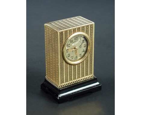 A miniature Swiss 14ct gold cased timepiece with engine turned decoration, circular silvered dial signed T. Kirkpatrick & Co,