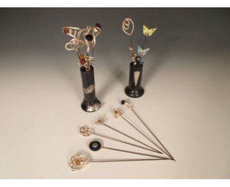 Fourteen Charles Horner hat pins and others, a collection of Charles Horner silver, enamel and stone topped steel hatpins, al