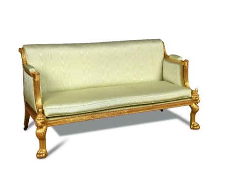 An Irish Regency gilt Suite in the manner of Thomas Hope, circa 1805 comprising a sofa and a pair of armchairs of Grecian sty