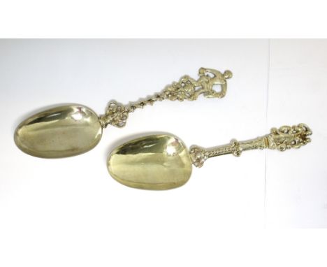 An 18th century Dutch parcel gilt silver birth spoon, apparently unmarked, with ovoid bowl and cast stem, the finial depictin