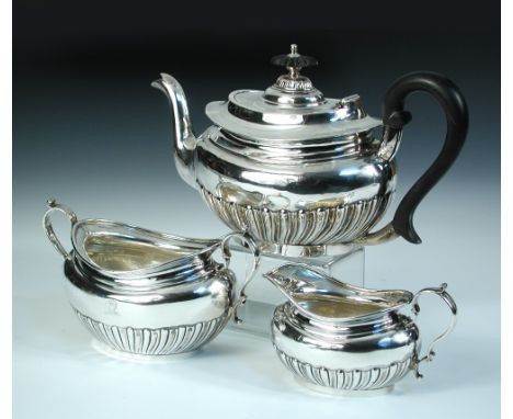 An Edwardian silver three piece teaset, by The Goldsmiths' and Silversmiths' Company, London 1905, comprising:- a teapot of c