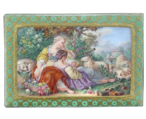 Attributed to Sevres, an 18th century snuff box lid, framed, painted with two shepherdesses reclining amongst flowers, their 