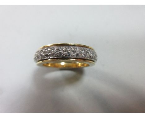 A Portuguese 19ct bi-coloured gold and diamond sliding hoop eternity ring, designed as a white gold hoop pavé set with round 