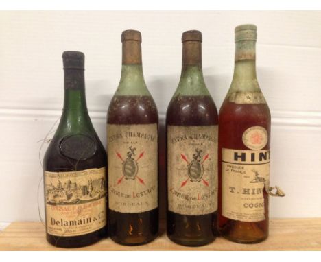 Old Cognac. Xavier de Lestapis, Extra Champagne Vieille, two bottles (stained labels); T.Hine three star, one bottle, torn la