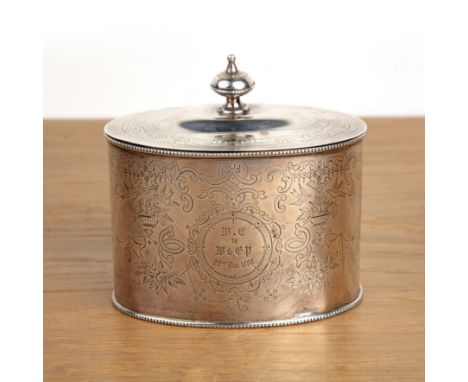 Victorian silver tea caddy of oval form, with knopped handle to the lid, with engraved decoration throughout, bearing marks f