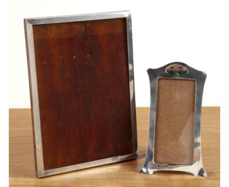 Arts and Crafts silver photo frame with enamel cartouche of trees in a landscape to the top, with rectangular stylised frame,