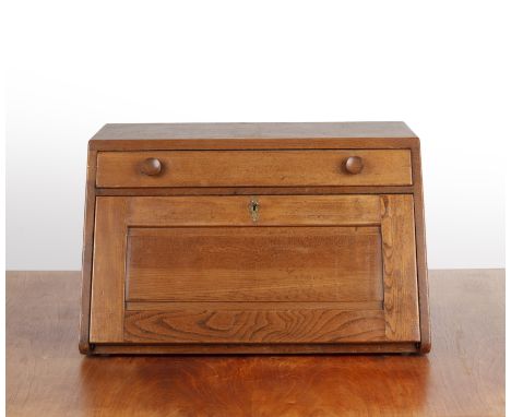 Ercol elm, desktop or compact bureau, with a drawer above a sloping fall front, with fitted interior, label to the reverse, 6