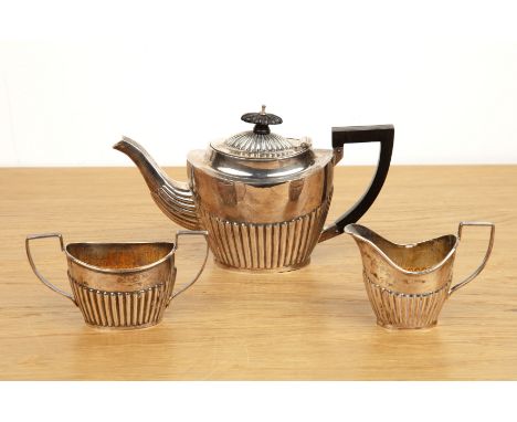 Edward VIII silver three piece bachelors tea setthe teapot with ebonised handle and finial, dated one year later than the mat